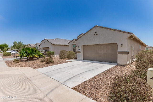 4713 W Nutmeg Ave, Coolidge, AZ 85128 - mediterranean / spanish house with an attached garage, driveway, and stucco siding