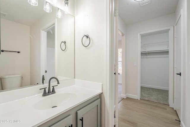 12813 W Paradise Dr, El Mirage, AZ 85335 - bathroom featuring vanity and wood finished floors
