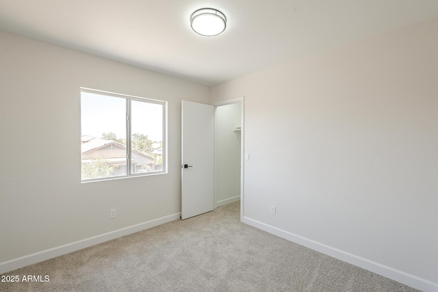 12813 W Paradise Dr, El Mirage, AZ 85335 - unfurnished room featuring light colored carpet and baseboards