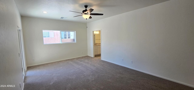 empty room with ceiling fan and carpet