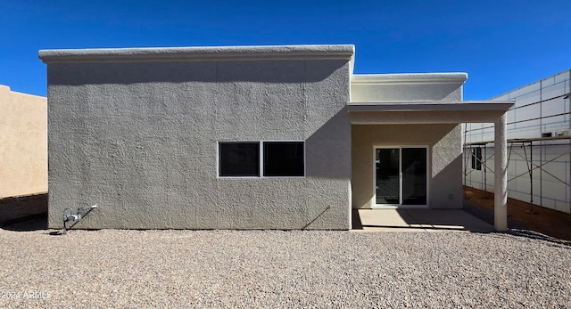 rear view of house featuring a patio