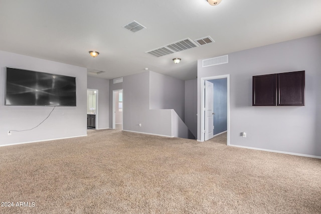 empty room featuring light carpet