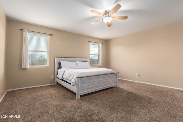 bedroom with dark carpet and ceiling fan