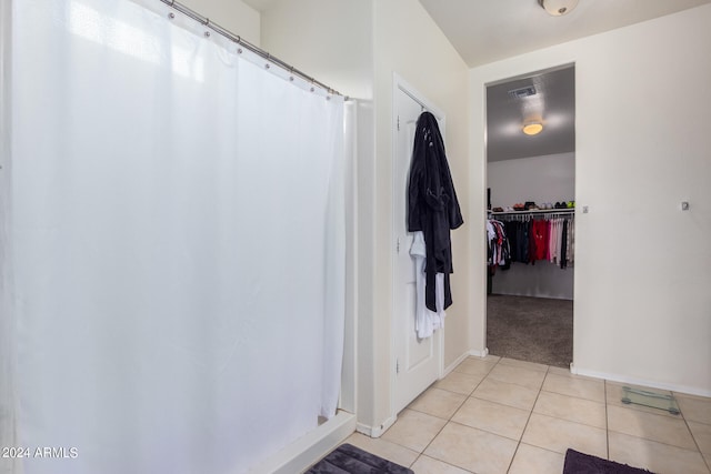 bathroom featuring tile flooring