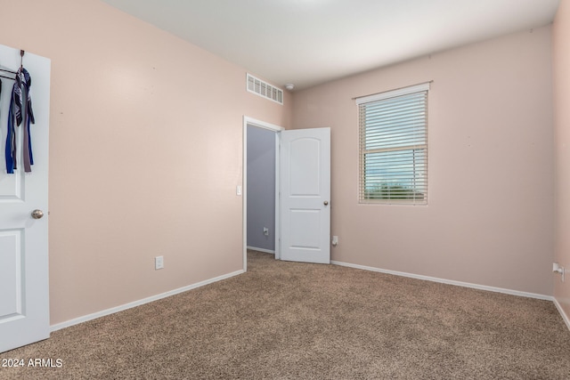 spare room featuring carpet