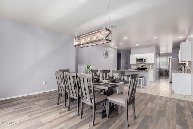 dining room featuring light wood-type flooring