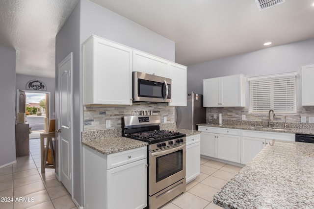 kitchen featuring white cabinetry, appliances with stainless steel finishes, and sink