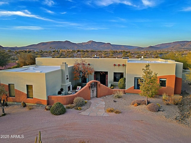 adobe home with a mountain view