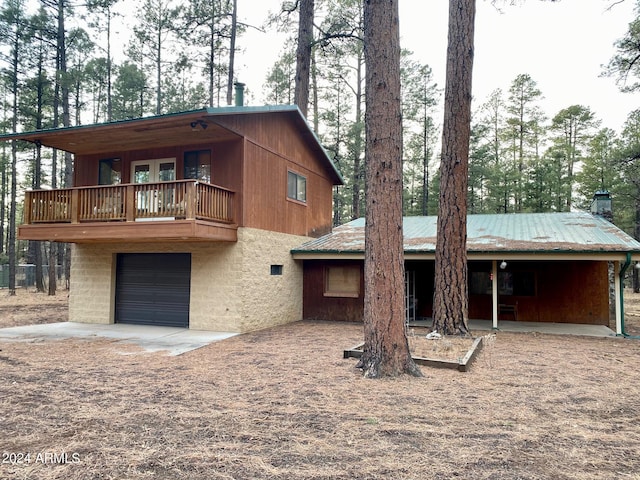 view of front of house with a balcony and a garage