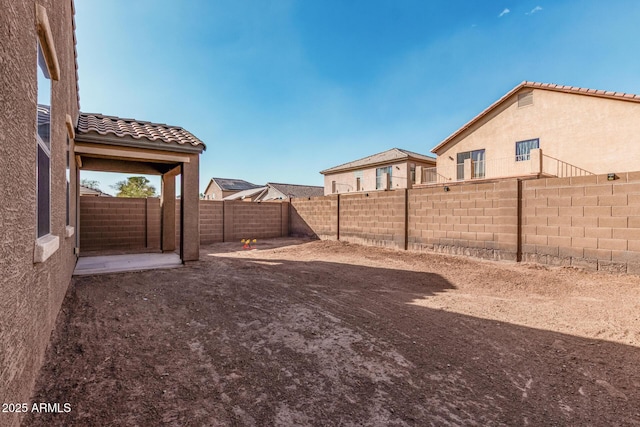 view of yard with a fenced backyard