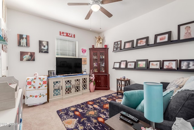 living room with light carpet and ceiling fan