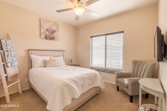 carpeted bedroom with ceiling fan and multiple windows