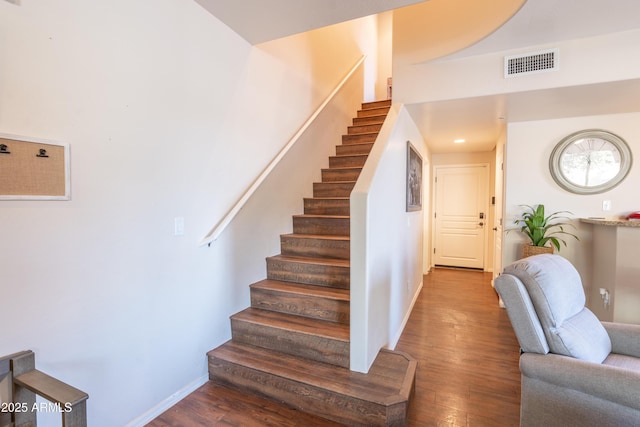 staircase featuring hardwood / wood-style floors