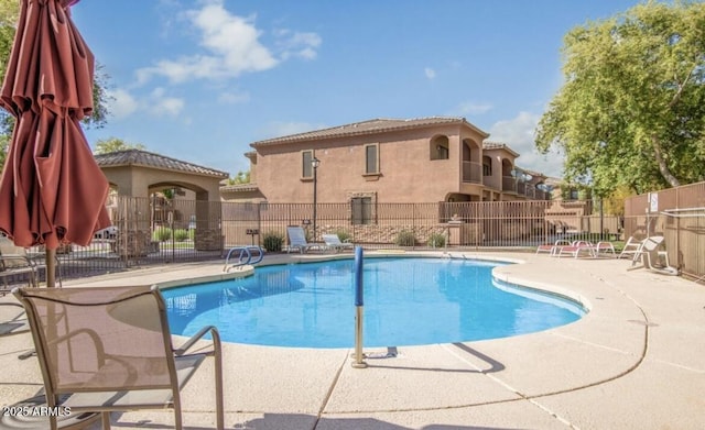 view of swimming pool featuring a patio area