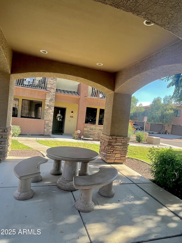 view of patio / terrace with a balcony