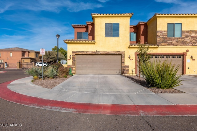 mediterranean / spanish-style house featuring a garage