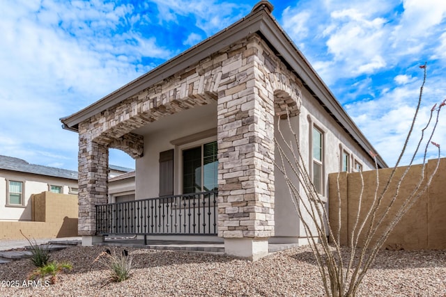 view of side of property featuring stucco siding