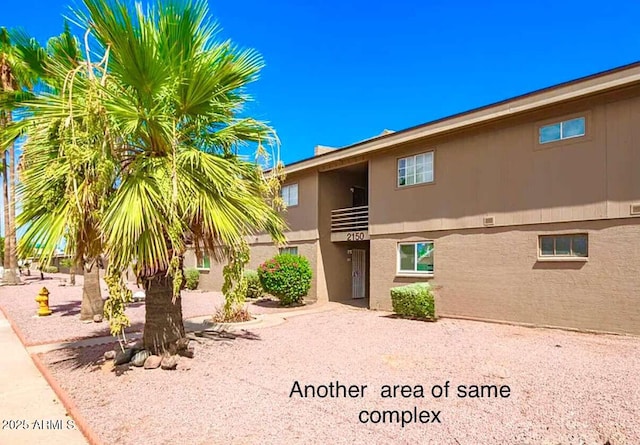 2150 W Missouri Ave Unit 120, Phoenix, AZ 85015 - exterior space featuring stucco siding and a balcony