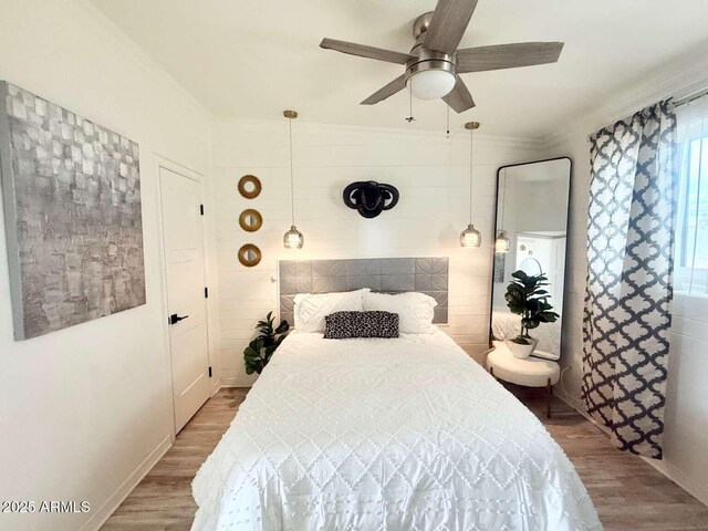 2150 W Missouri Ave Unit 120, Phoenix, AZ 85015 - bedroom featuring baseboards, a ceiling fan, and wood finished floors