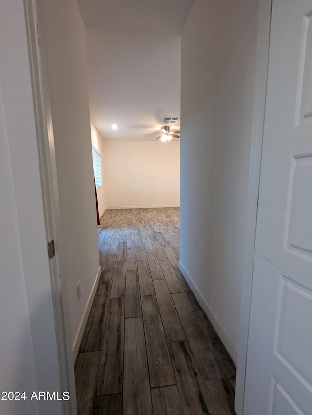 corridor with dark hardwood / wood-style floors