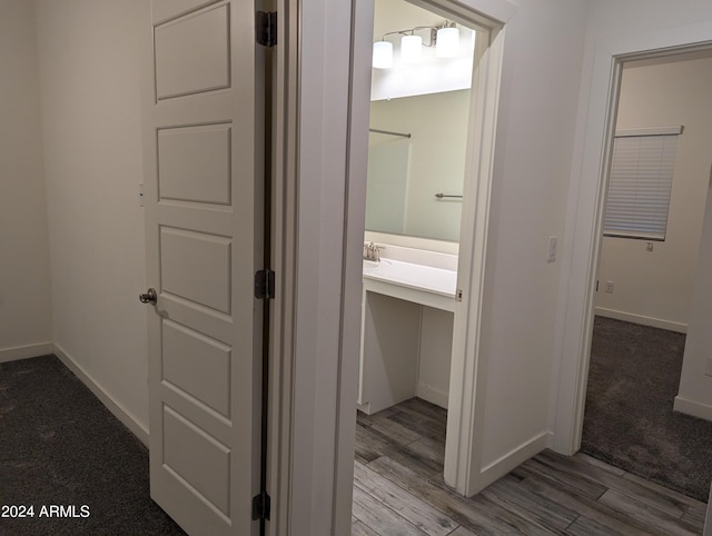 corridor with light hardwood / wood-style floors