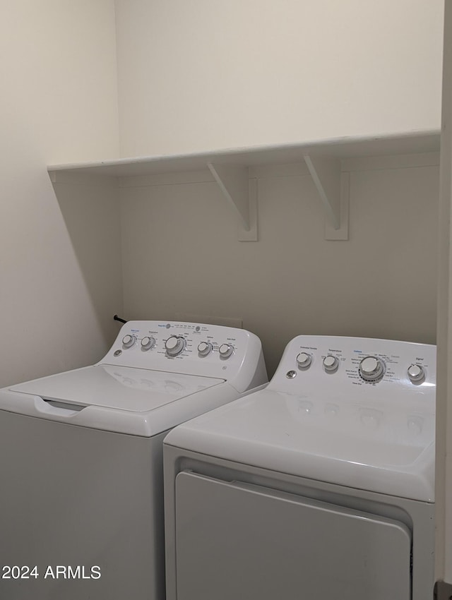 laundry room featuring washer and clothes dryer