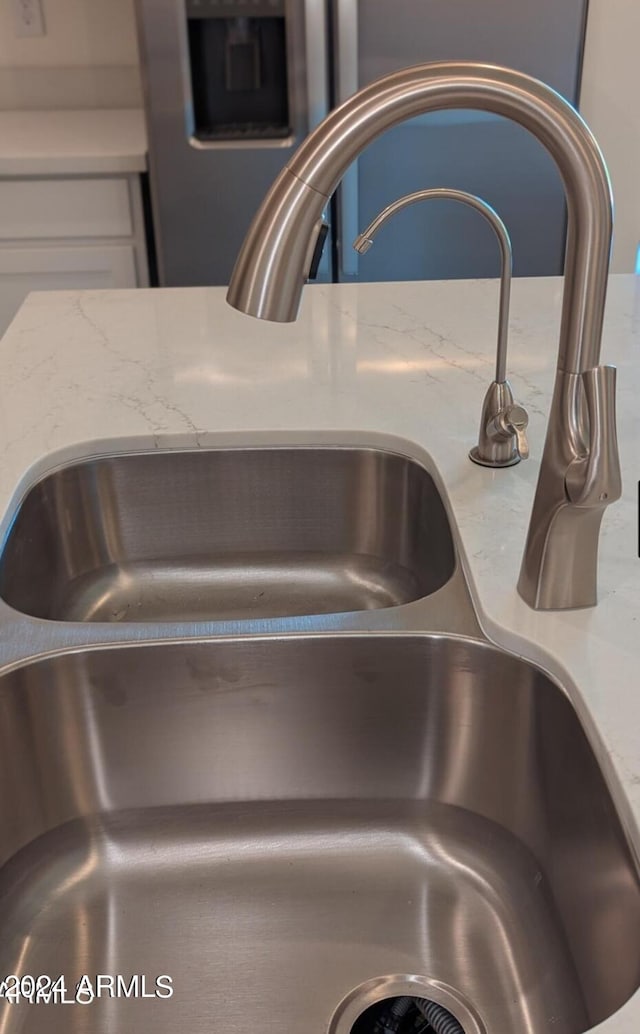 interior details with sink and light stone counters