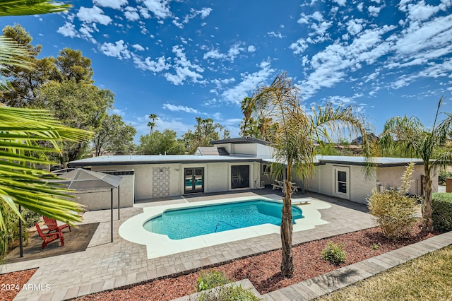 outdoor pool with a patio area