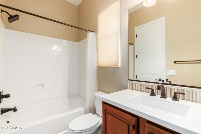 full bathroom with vanity, toilet, and shower / bathtub combination with curtain