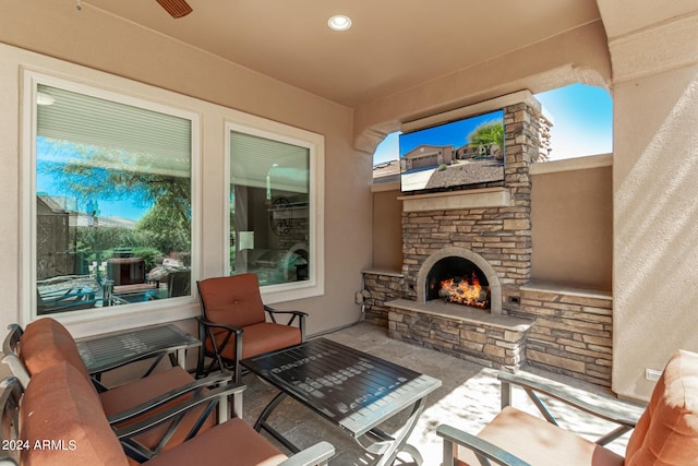 view of patio / terrace featuring an outdoor stone fireplace