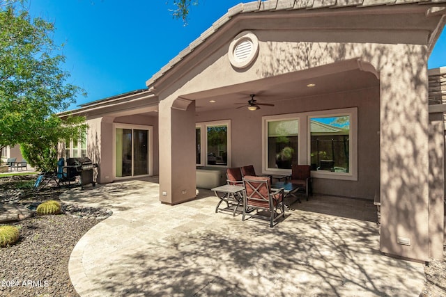 exterior space with ceiling fan and grilling area