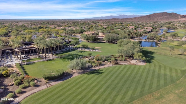 birds eye view of property with a water and mountain view