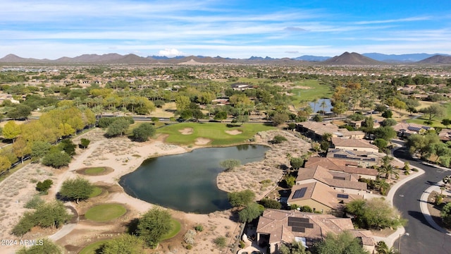 drone / aerial view featuring a water and mountain view