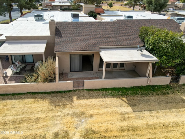 rear view of property featuring a patio area