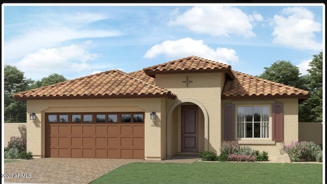 mediterranean / spanish-style house featuring a front yard and a garage