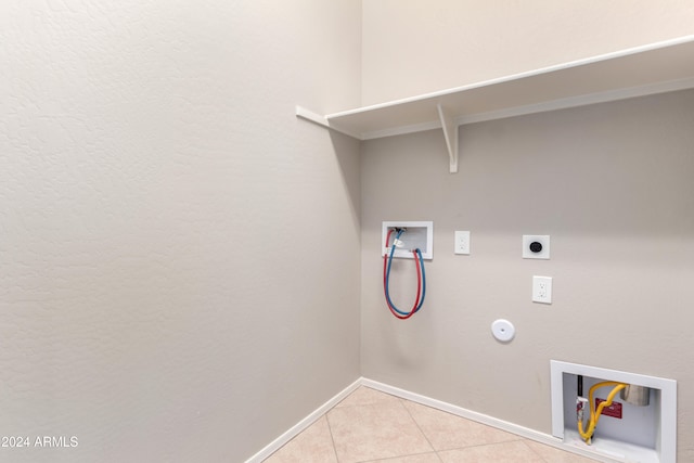 laundry area featuring hookup for a washing machine, light tile patterned floors, hookup for a gas dryer, and electric dryer hookup