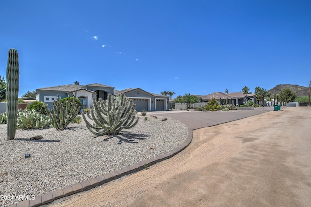 view of front of property featuring a garage and driveway