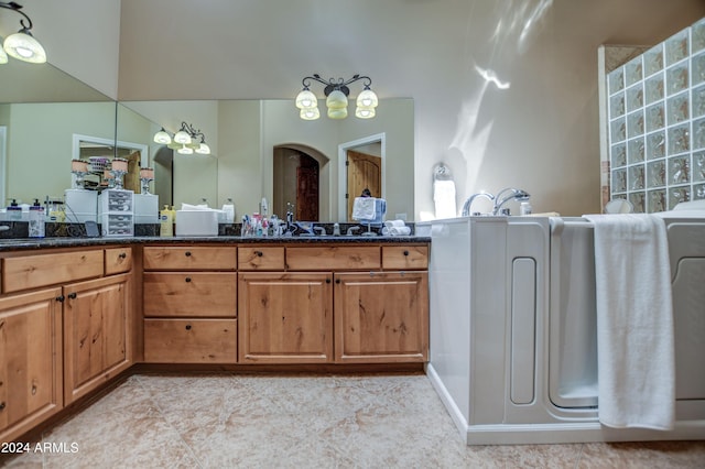 bathroom with tile patterned floors and vanity