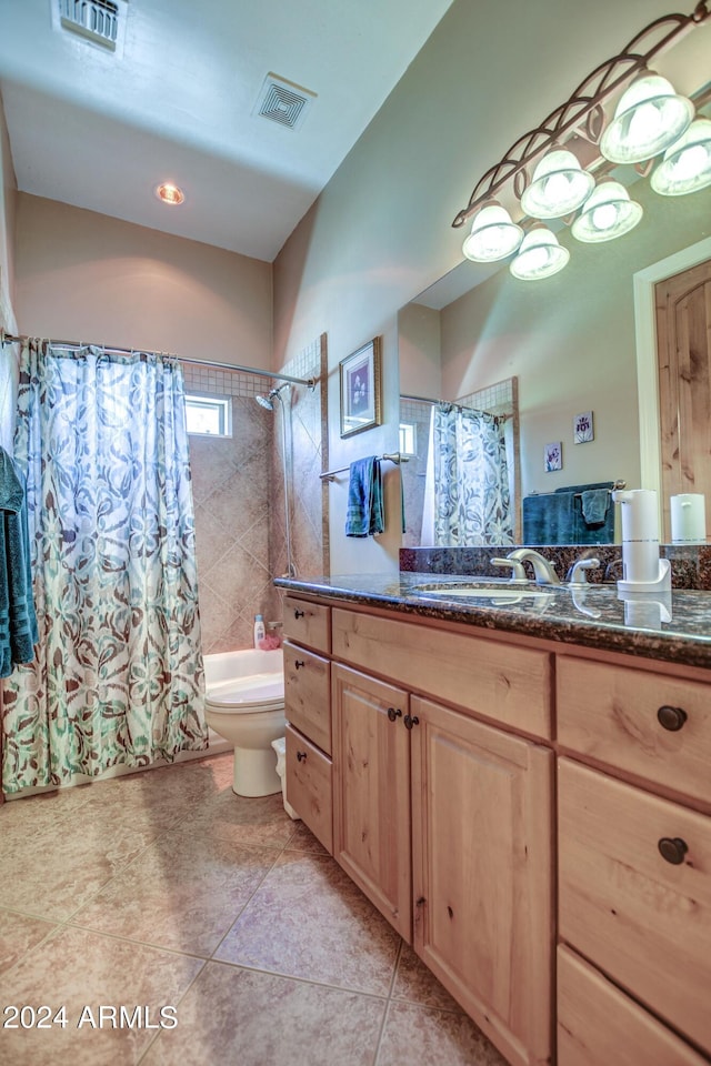 full bath with visible vents, toilet, shower / bath combo, and vanity