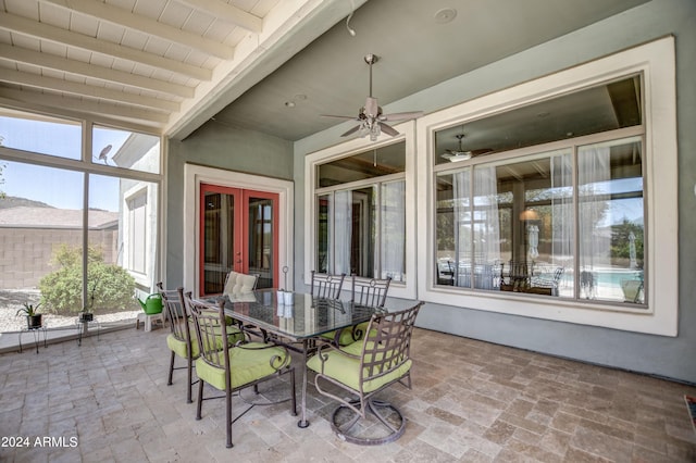 view of patio / terrace featuring french doors, outdoor dining area, and a ceiling fan