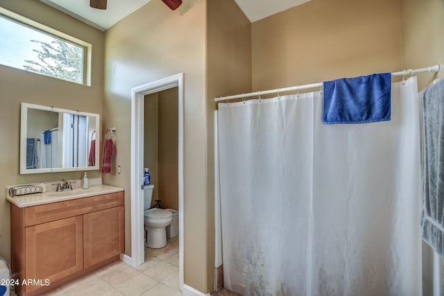 full bathroom featuring toilet, curtained shower, tile patterned flooring, ceiling fan, and vanity