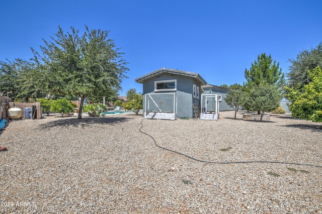 view of outdoor structure featuring an outdoor pool