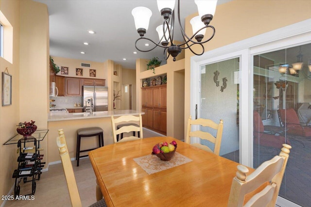 dining area featuring an inviting chandelier