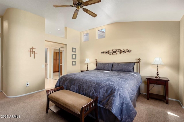 carpeted bedroom with vaulted ceiling and ceiling fan