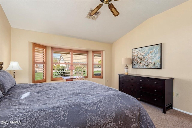 carpeted bedroom with vaulted ceiling and ceiling fan