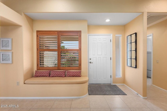 entryway featuring light tile patterned floors