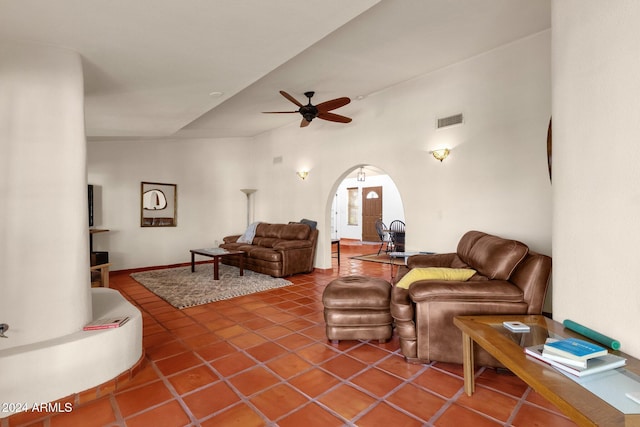 living room with vaulted ceiling, ceiling fan, and tile patterned flooring