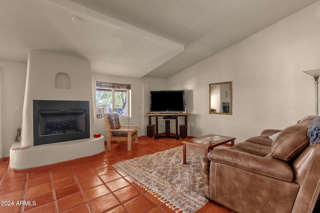 tiled living room featuring a large fireplace and lofted ceiling