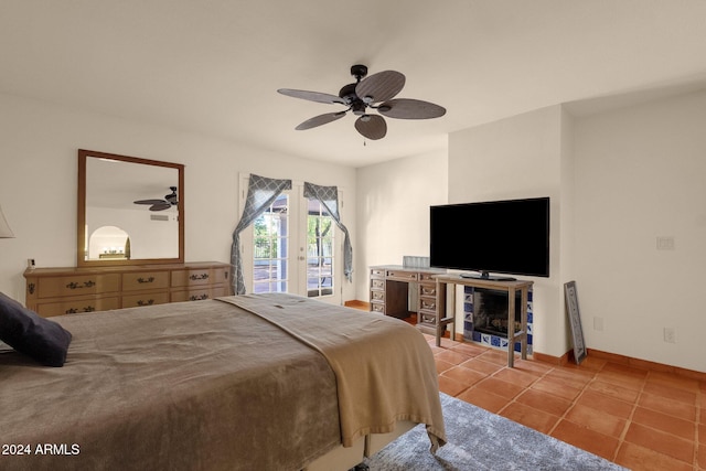 bedroom with light tile patterned flooring, access to outside, and ceiling fan