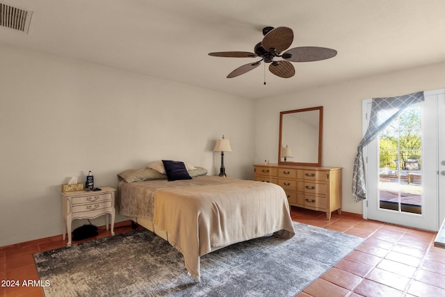 tiled bedroom featuring ceiling fan and access to outside